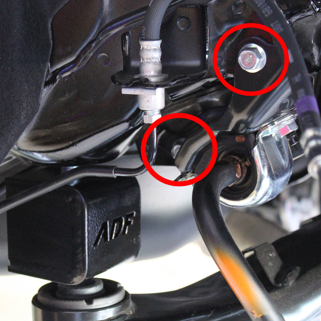 Rear sway bar lock down kit